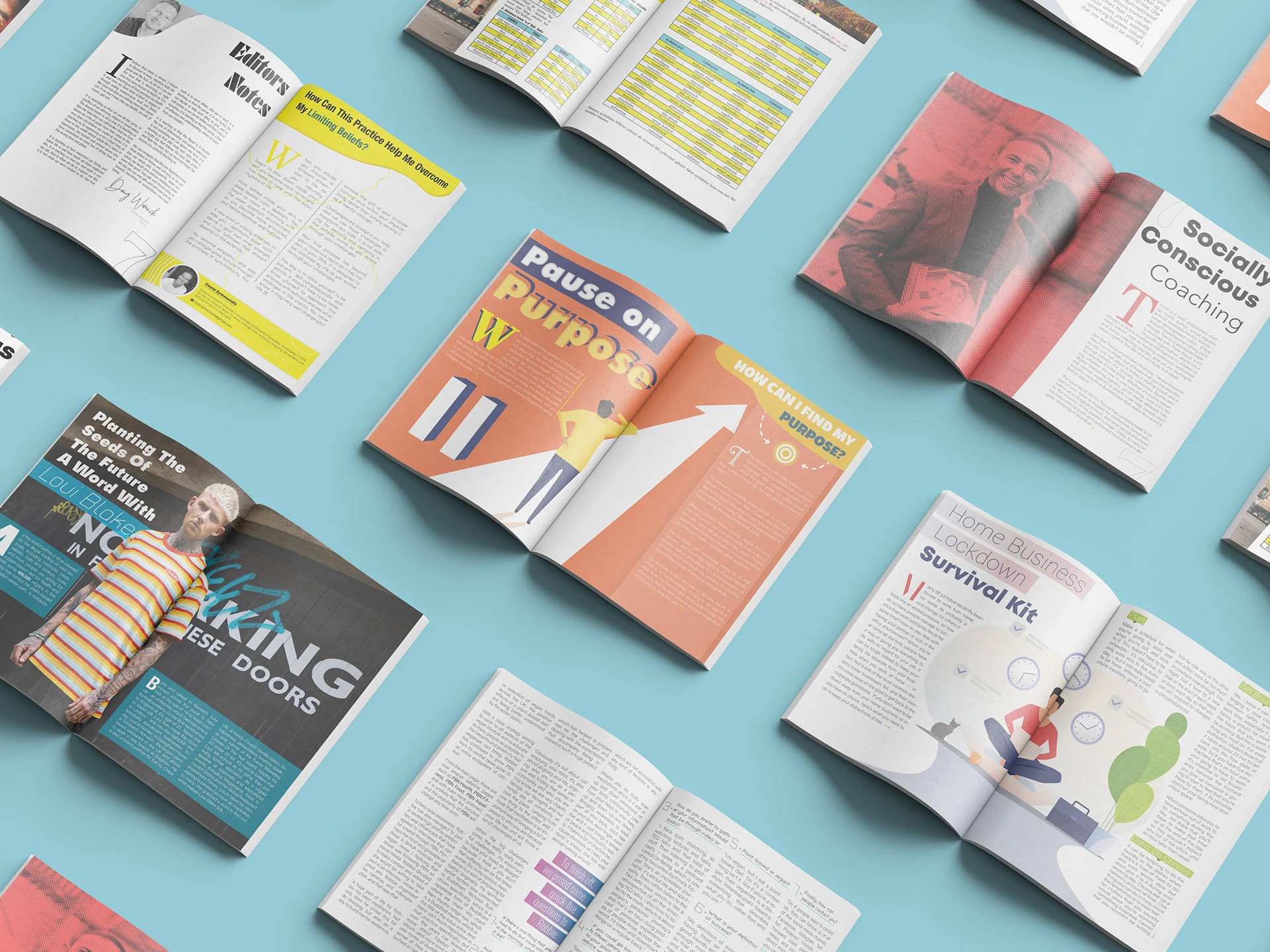 A variety of magazines and books laid out on a blue surface