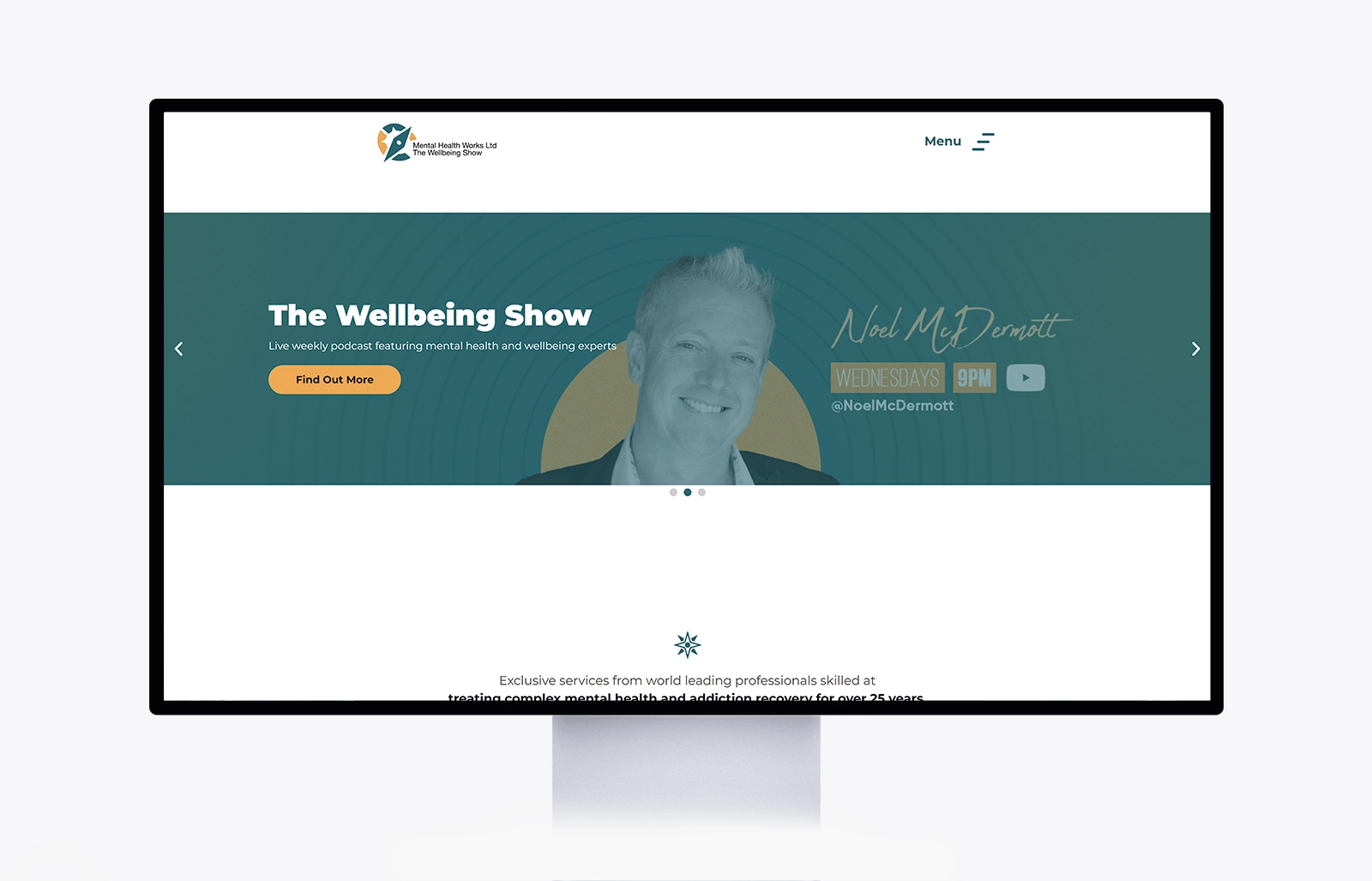 A desktop monitor displaying the Mental Health Works website